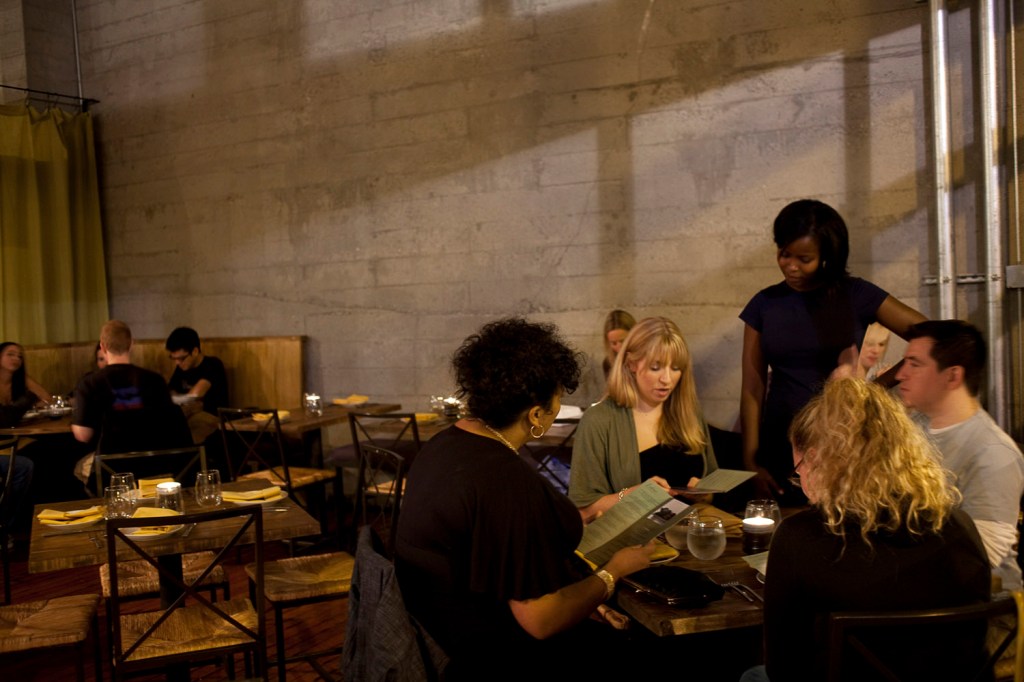 Maybe the sandwich just tastes better because of its surroundings. Howell took over Cafe StellinaaE™s space in the Piston & Ring buildingaE”and did nothing to it. Instead, sheaE™s banking on the striking appeal of the raw space, with its concrete walls and poured concrete floors, its slim wood tables, its open kitchen, and its garage-door front window.