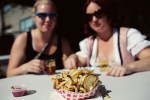 Amy and Christine contemplate their cube of french fries.