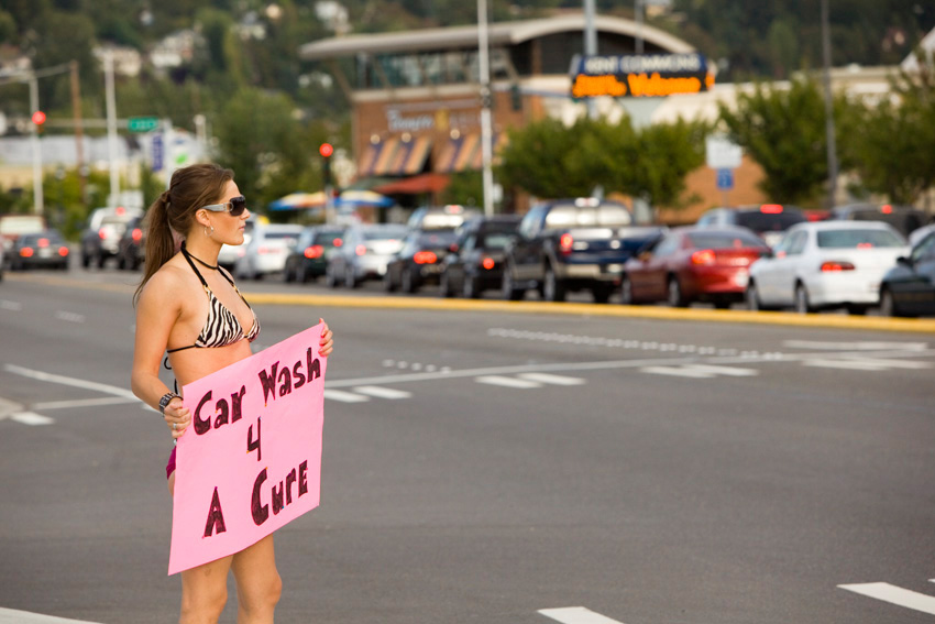 Center Jenna Bloczynski hails traffic from James Street during rush hour.