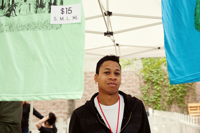 Devon mans the merch table.