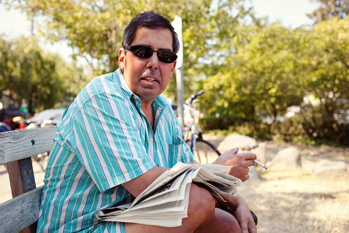 Charles lives down the street.A  The ventilation in his apartment isn't very good so he comes down to the beach off and on during the day to read and have a smoke.