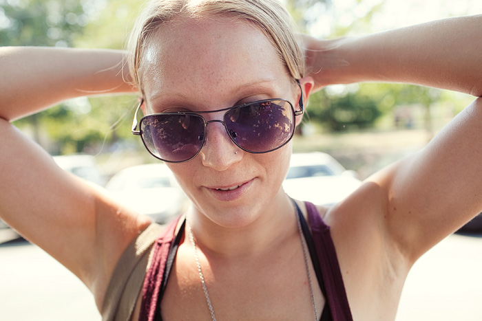 Nancy, one of the bikers, ties up her hair after tying up her bike.