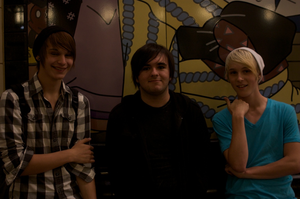 Conor, left, said he plans to take the train partway to the airport next week. Kevin Sharp, middle, was impressed with the cool art at the Beacon Hill station and that it smelled of new paint. Kurt, right, said the train is convenient, having come downtown from Beacon Hill.