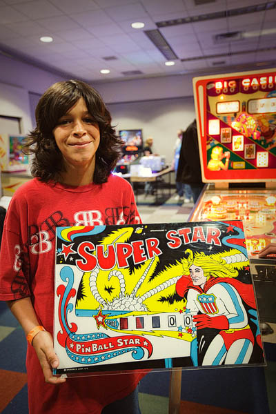Jacob shows off the Super Star scoreboard he won in the raffle.