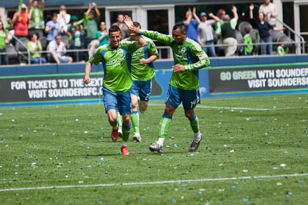 Sebastien Le Toux celebrates with Tyrone Marshall after scoring the first goal of the match and his first as a Sounder.