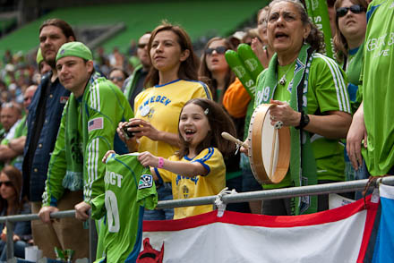 One of the smaller fans cheers on her team.