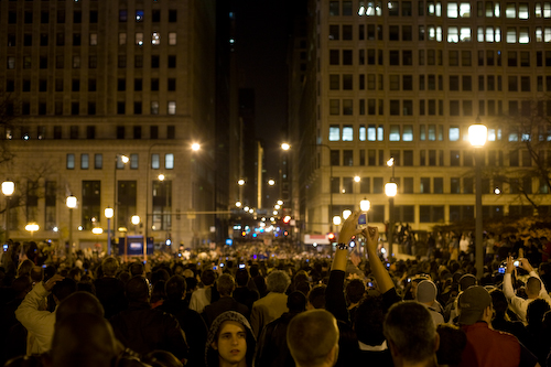 The crowd fills the streets outside Grant Park, cheering, Obama! Obama! Obama!