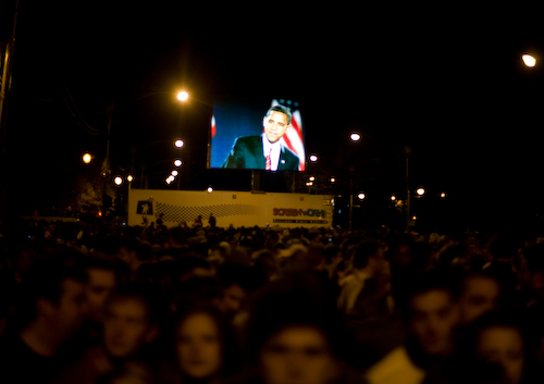 Obama looks down on the crowd from a Jumbotron screen as they leave Grant Park.