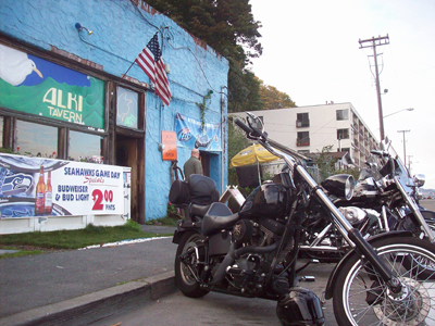 Beef, Beer and the Pigskin at Alki Tavern: The right side of the bar at Alki Tavern features a painting of a motorcycle, except instead of a roaring engine, tubes and pipes, the body of the bike is a g-string-clad woman. Other late-eighties pinupsaE”neon halters, chunky bangles, strategically placed snakes and allaE”adorn the walls. And a giant American flag drapes over the tables. It's hard to imagine a better spot for gridiron gazingaE”no one is here to watch football as an act of artistic irony or a chance to hit on their frat brother's sister, in town from Michigan. True, the one television is a little small and definitely not Hi Def, but if you want to hang with the popped collars at the Fox Sports Grill, be my guest.