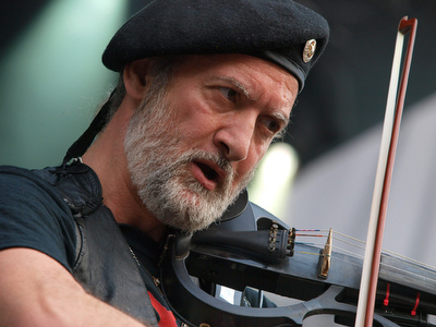 The band is called Gogol Bordello.  They played at 4:40 on the AT&T stage.