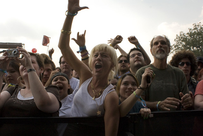 The crowd reacts as Gogol Bordello plays.