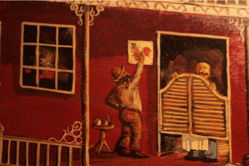 Most of the people that know the story of this mural have either moved or passed on, but those that loved or worked at the bar back then are immortalized as western shop keeps or cowboys including Jeffries himself, who died in December 2006, seen here painting a hen.