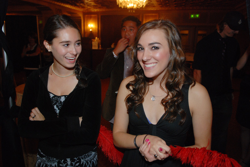 The feather girls are actually auction assistants.