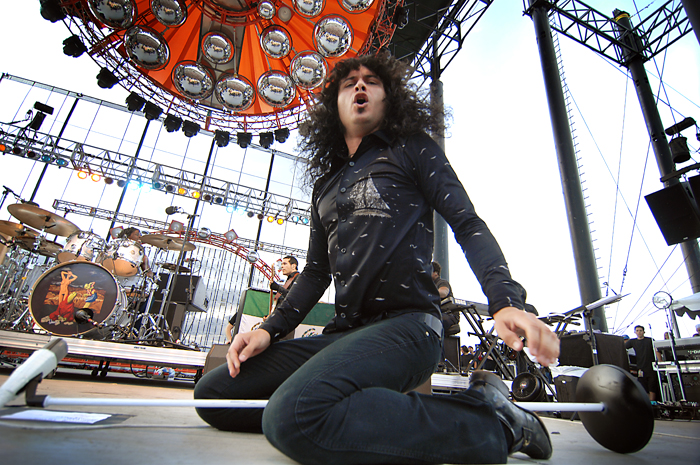 The Mars Volta's Cedric Bixler-Zavala tried to snatch our photog's livelihood. She kept her hands away from his.