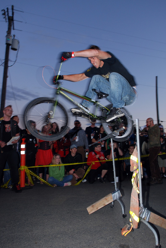 Knocking over the bar in the bunny-hop competition.