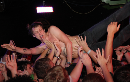 Lunn dives into the crowd near the end of Monday nightaE™s show.
