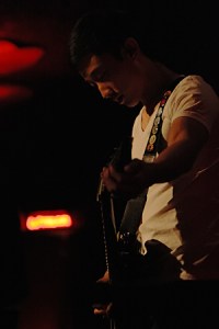 Daniel, guitarist for New Heights, tunes up during the Federal Way band's set on Tuesday night.