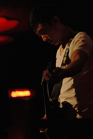 Daniel, guitarist for New Heights, tunes up during the Federal Way band's set on Tuesday night.