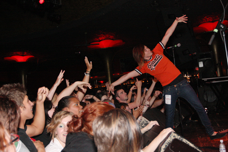 Toe of Holyfield poses with fans before the band's set.