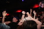 With no divider between the audience and the stage, crowd surfers (like this guy) ended up being thrown at the band.