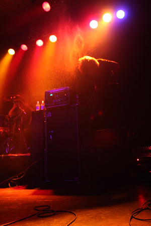 Moneta's Jeremiah perches on top of an amp during Tuesday nightaE™s show.
