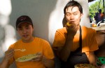 Thanh Do and Thinh Pham take a break to get a bite.