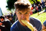 John chomps on an ear of corn.