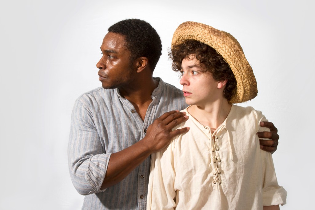 Simmons (left) and Morson prepare to raft the Mississippi.