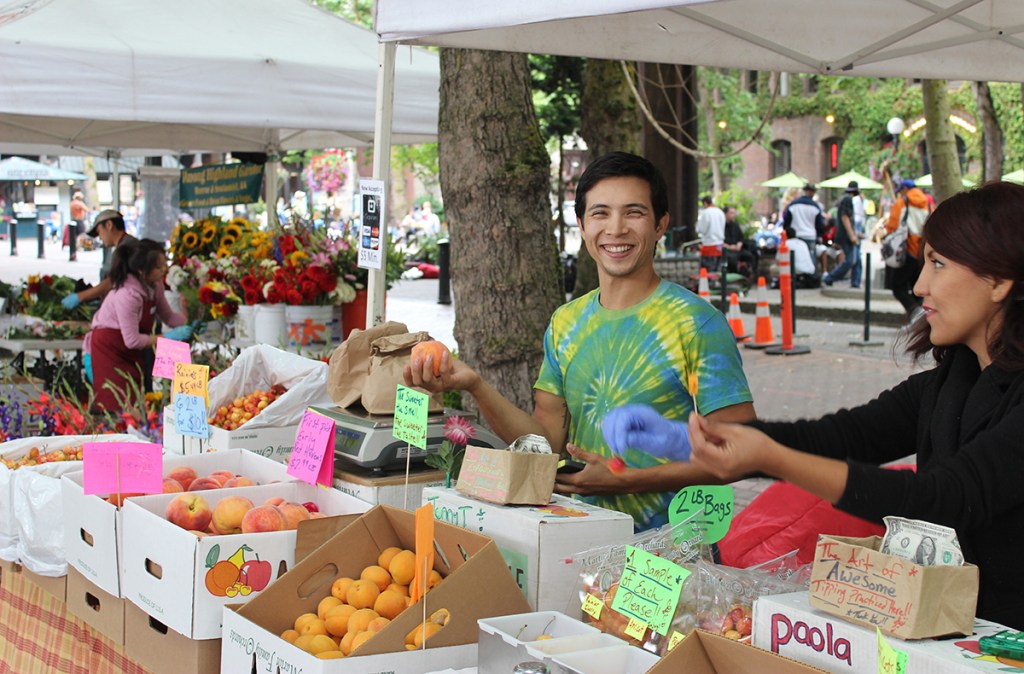 Fresh peaches from Martin Family Orchards at the large gathering of Pike’s market vendors and shoppers in Occidental Park.
