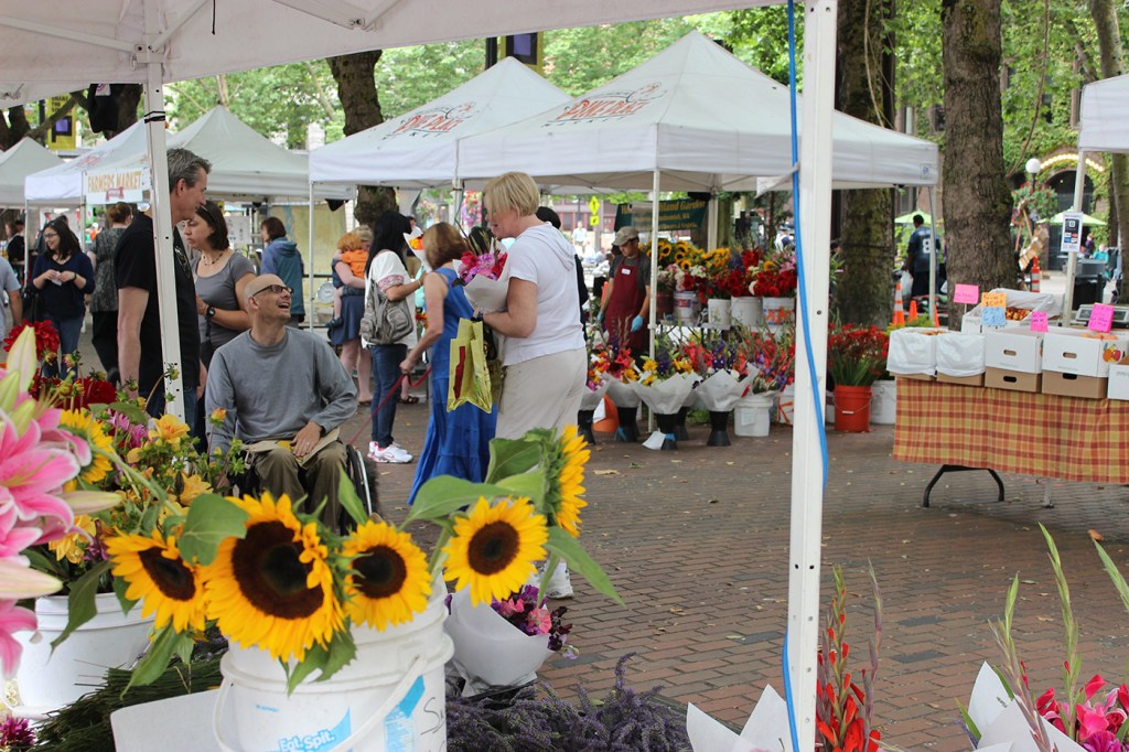 Fresh peaches from Martin Family Orchards at the large gathering of Pike’s market vendors and shoppers in Occidental Park.