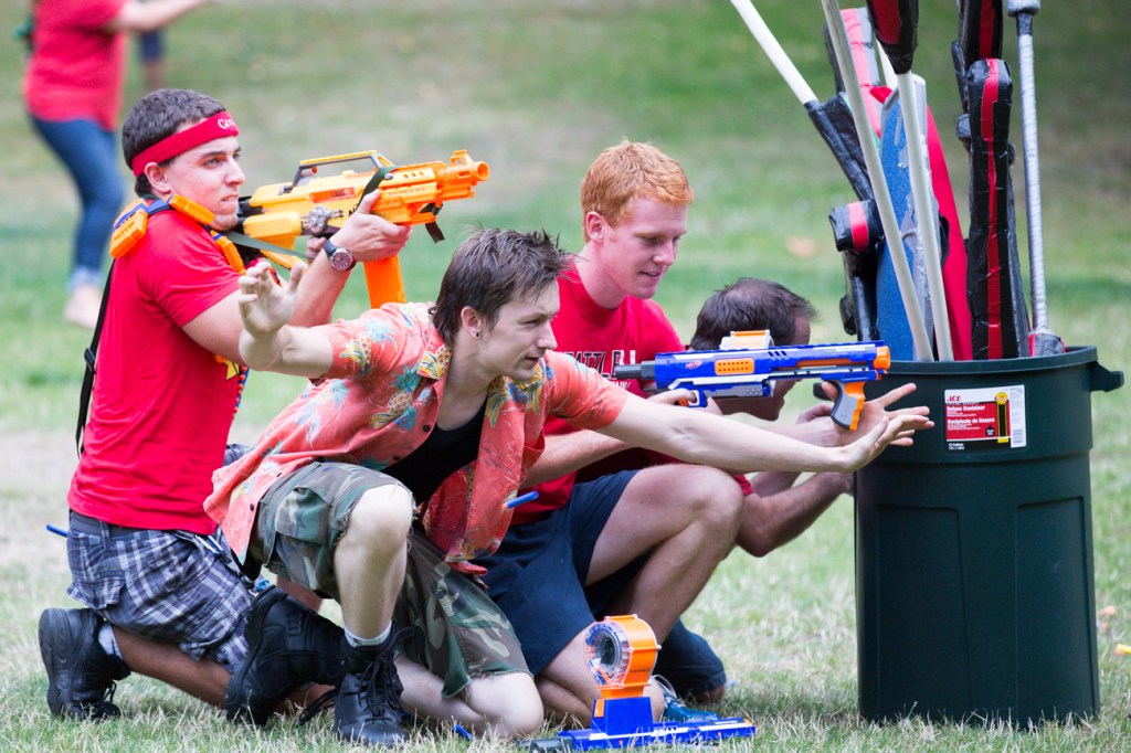 Hiding behind an obstacle several red team members take a strong position. Despite the cover all four were wiped out by an onslaught of enemy foam moments later.