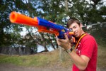 Brandishing a long range Nerf rifle, Skylar Iolta protects his territory during a capture the flag match.
