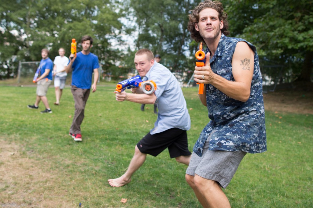Members of the blue team fan out.