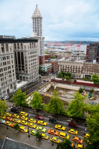 Taxis line the streets in front of City Hall in protest.