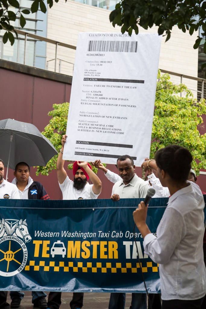 At an Aug. 2 protest, cab drivers issue the city a “Citation for Inaction.”