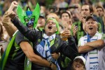 Fans celebrate a goal by Sounders forward Eddie Johnson in the 60th minute. The goal put Seattle on track to beat Portland 1-0.
