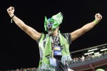 A super fan celebrates a Sounders victory post game.