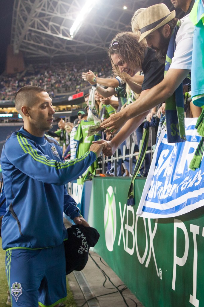 New Seattle star Clint Dempsey signs autographs post-game.