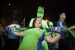 Sounder fans dance outside the stadium after the game.