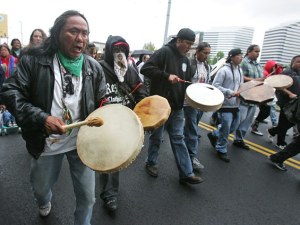 Marchers protest the police shooting of John T. Williams, a Native American woodcarver, in 2010.
