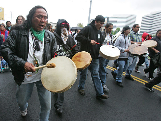 Marchers protest the police shooting of John T. Williams, a Native American woodcarver, in 2010.