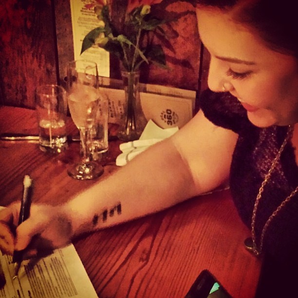 Lambert signing the big deal...at Local 360. Photo courtesy of the artist.