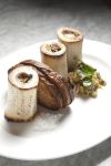Three charred, columnar marrow bones are packed with marvelous fat at The Whale Wins (Photo by Joshua Huston)
