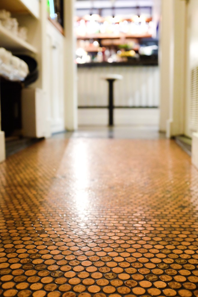 Top, a warm vibe. Bottom left, bartender Jeff Steiner. Bottom right, a floor of shiny pennies.