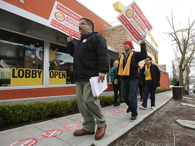 Dozens picketed outside of the McDonald’s on Third Avenue and Pine Street