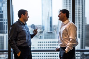 The long view: Zach Silk, left, advises Nick Hanauer on his political operations from his boss’s office overlooking downtown Seattle.