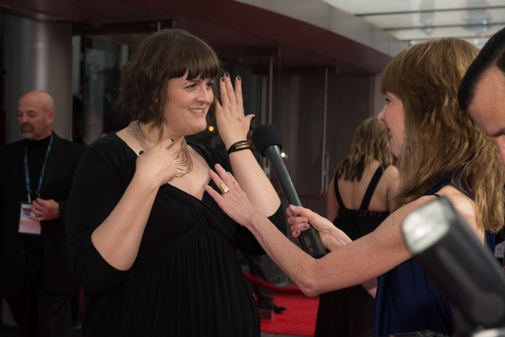 Local director Megan Griffiths chatting with the media about her fabulous jewelry.