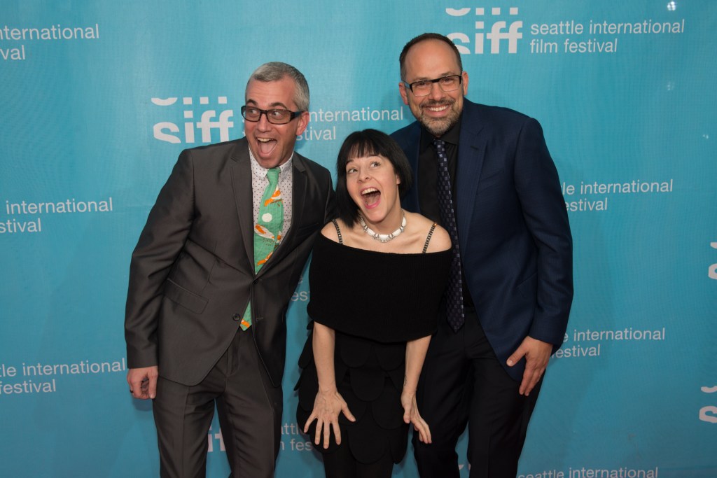 Film and music advocate James Keblas and wife Heather Elsa mug with Spence.