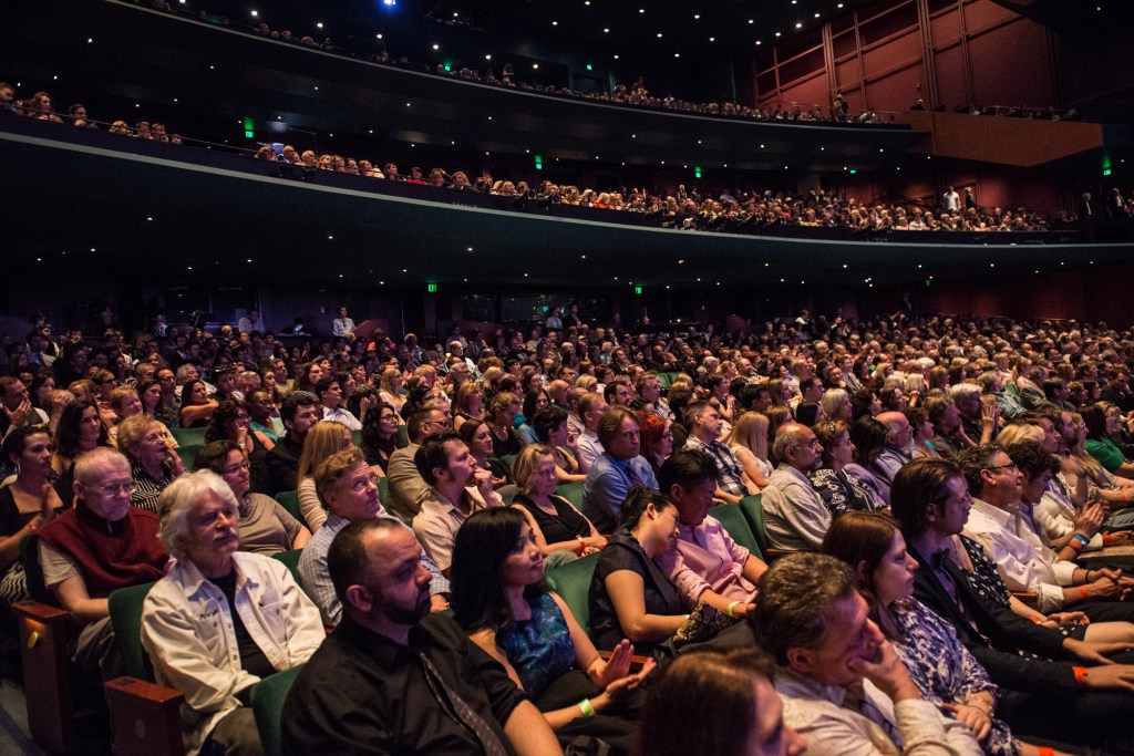 The crowd responded to the good news with cheers.