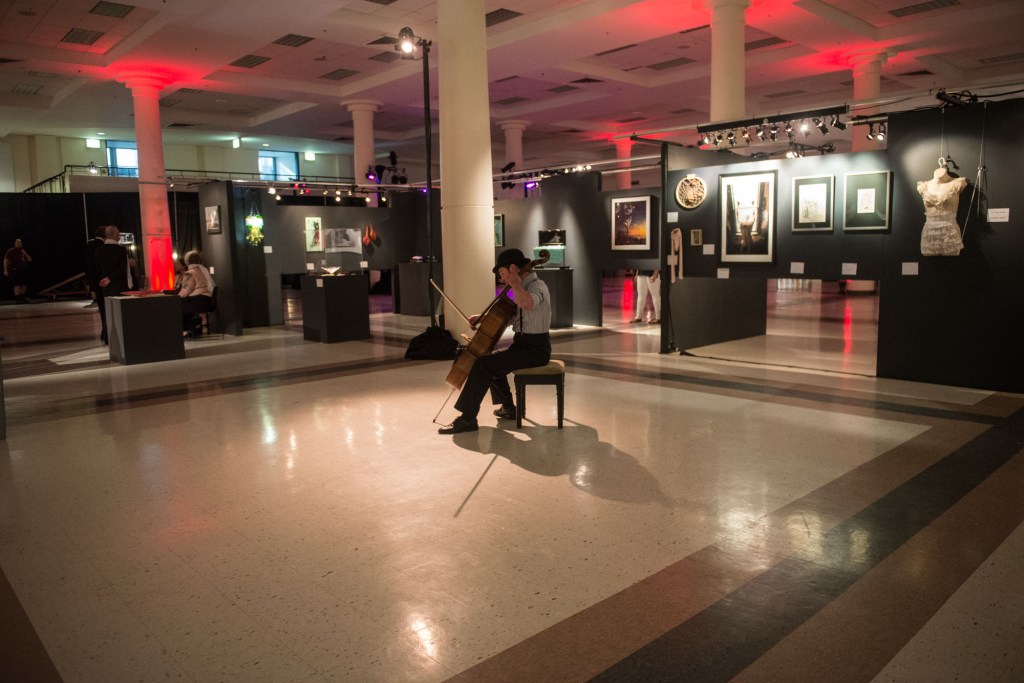 To add a little mood music without piping it throughout the entire hall, a string player performed for about two hours with dulcet and dark tones.